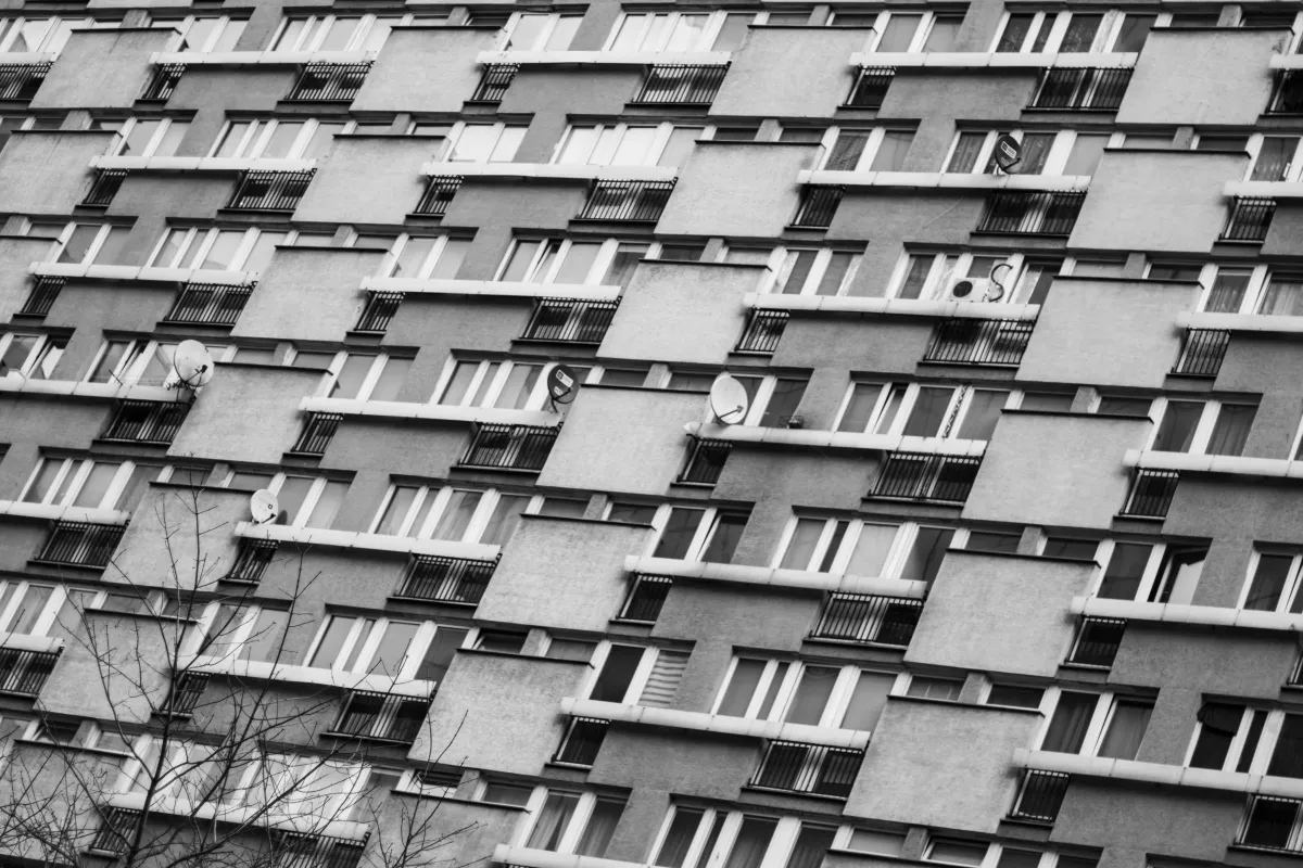 Repeating windows across a monochrome apartment block
